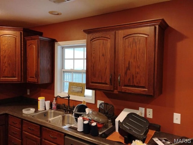 1107 Daffodil St, Sikeston, MO 63801 - kitchen with a sink and dark countertops