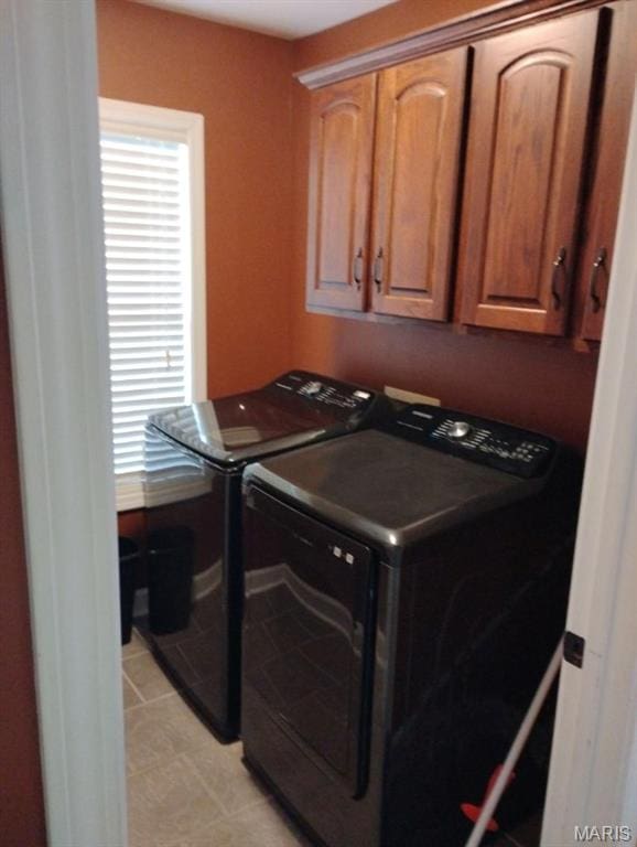 1107 Daffodil St, Sikeston, MO 63801 - washroom featuring washer and clothes dryer and cabinet space