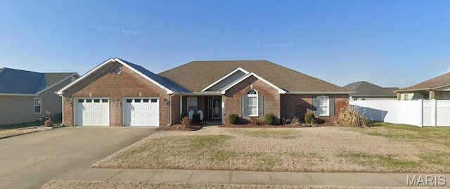 1107 Daffodil St, Sikeston, MO 63801 - view of front facade featuring brick siding, concrete driveway, and an attached garage