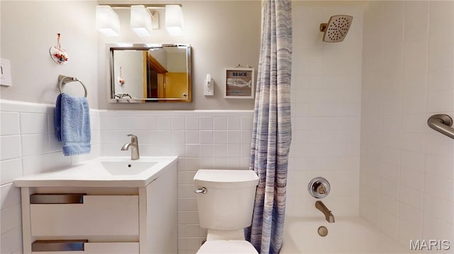 9334 Litzsinger Rd, Rock Hill, MO 63144 - bathroom featuring shower / bath combination with curtain, vanity, tile walls, and a wainscoted wall