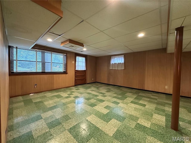 9334 Litzsinger Rd, Rock Hill, MO 63144 - unfurnished room with wood walls and a drop ceiling