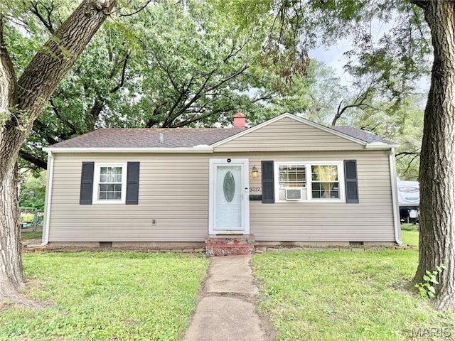 3212 Rodger Ave, Granite City, IL 62040 - view of front facade featuring crawl space, a front lawn, entry steps, roof with shingles, and a chimney