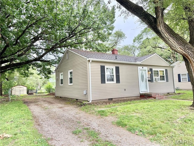 3212 Rodger Ave, Granite City, IL 62040 - view of front of property with crawl space, a chimney, roof with shingles, a shed, and entry steps