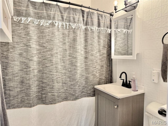 3212 Rodger Ave, Granite City, IL 62040 - full bathroom with tile walls, vanity, and a shower with curtain