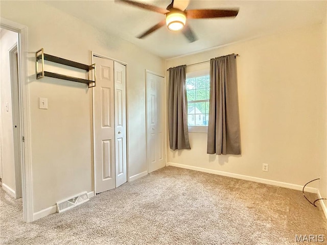 3212 Rodger Ave, Granite City, IL 62040 - unfurnished bedroom with carpet flooring, two closets, and ceiling fan