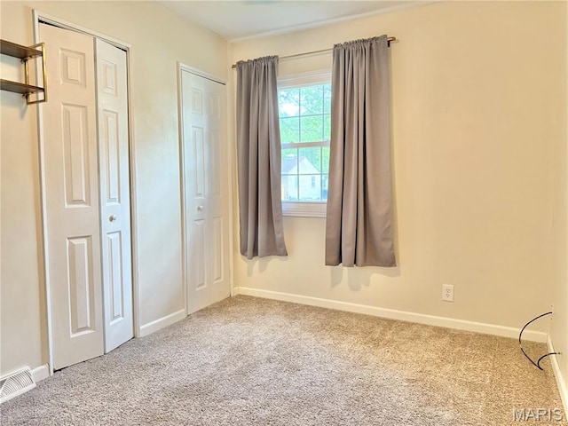 3212 Rodger Ave, Granite City, IL 62040 - unfurnished bedroom with carpet flooring and multiple closets