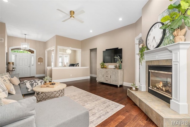 4304 Austin Pass Ct, Saint Charles, MO 63304 - living area featuring dark wood finished floors, a ceiling fan, a tiled fireplace, and recessed lighting