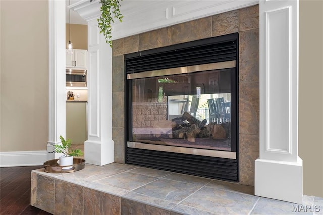 4304 Austin Pass Ct, Saint Charles, MO 63304 - detailed view of stainless steel microwave and a fireplace