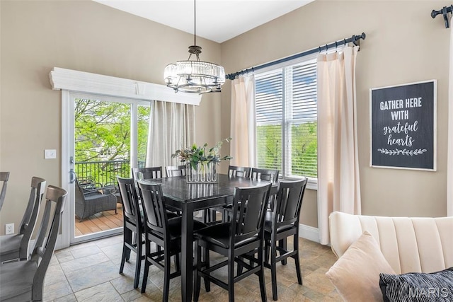 4304 Austin Pass Ct, Saint Charles, MO 63304 - dining space featuring stone tile flooring and a chandelier