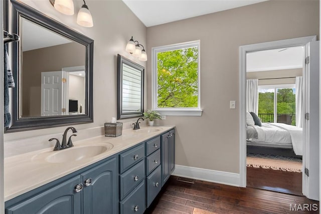 4304 Austin Pass Ct, Saint Charles, MO 63304 - bathroom with double vanity and wood finished floors