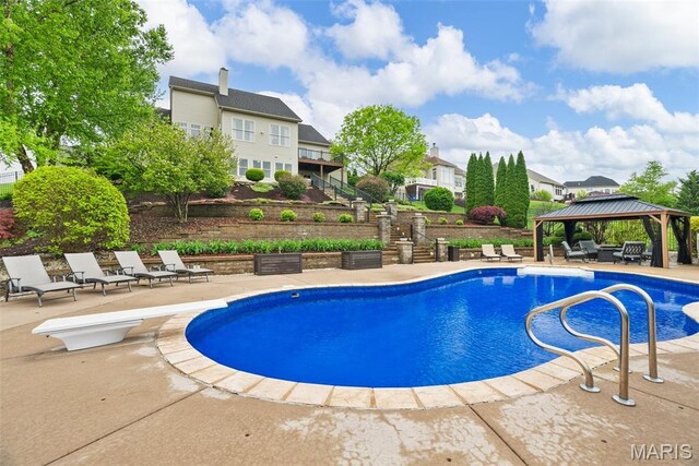 4304 Austin Pass Ct, Saint Charles, MO 63304 - swimming pool with a gazebo, stairway, a patio, and a diving board