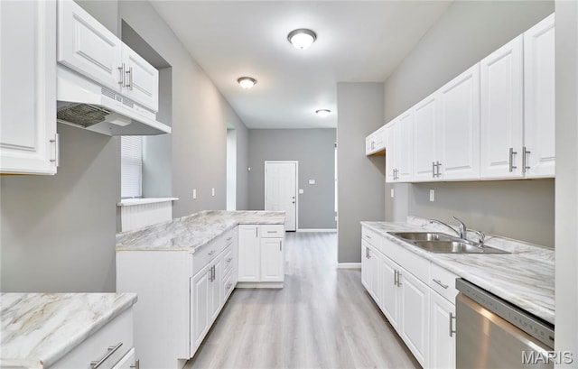 4275 E Ashland Ave, Saint Louis, MO 63115 - kitchen featuring stainless steel dishwasher, under cabinet range hood, light wood finished floors, white cabinetry, and light stone counters