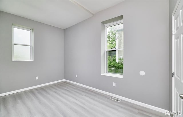 4275 E Ashland Ave, Saint Louis, MO 63115 - spare room featuring wood finished floors