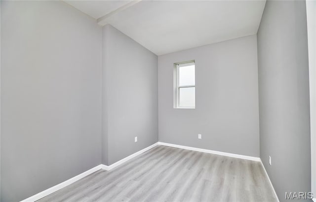 4275 E Ashland Ave, Saint Louis, MO 63115 - empty room featuring wood finished floors and lofted ceiling