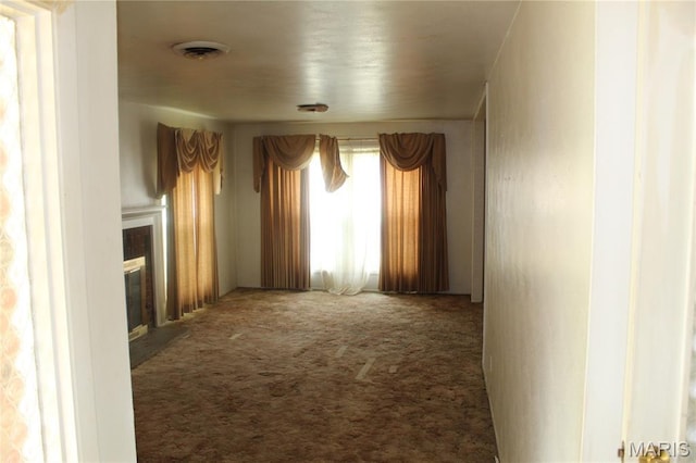 4 Primrose Ln, Fairview Heights, IL 62208 - unfurnished room featuring carpet flooring and a glass covered fireplace