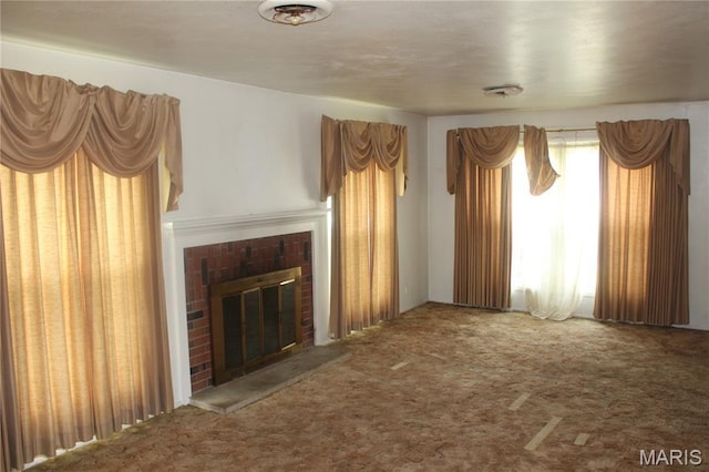 4 Primrose Ln, Fairview Heights, IL 62208 - unfurnished living room with a brick fireplace and carpet flooring