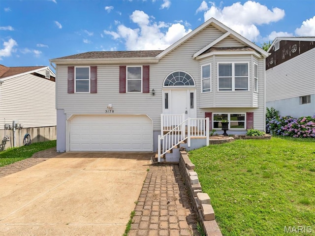 3178 5 Oaks Dr, Arnold, MO 63010 - bi-level home featuring a garage, concrete driveway, and a front yard