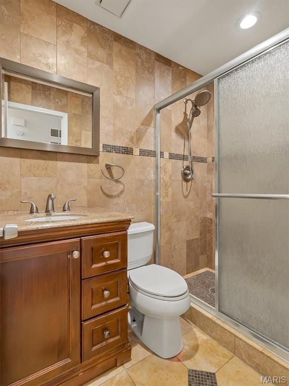3178 5 Oaks Dr, Arnold, MO 63010 - bathroom featuring tile walls, a shower stall, vanity, tile patterned flooring, and decorative backsplash