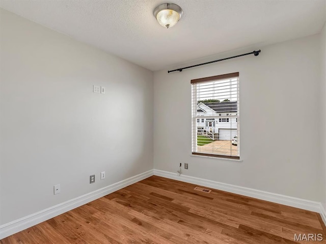 3178 5 Oaks Dr, Arnold, MO 63010 - empty room featuring baseboards and wood finished floors