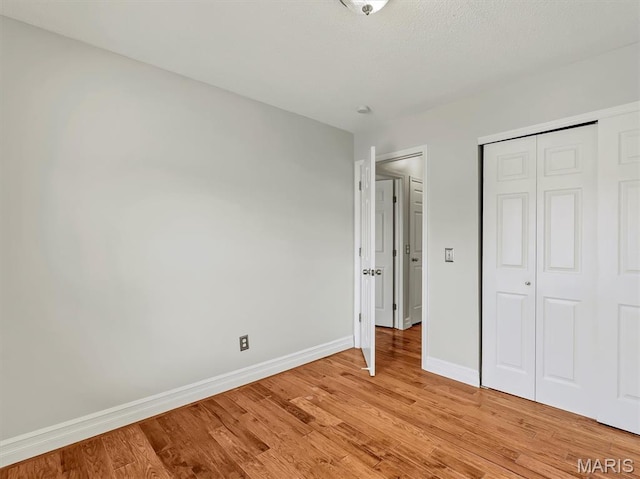 3178 5 Oaks Dr, Arnold, MO 63010 - unfurnished bedroom with light wood finished floors and a closet