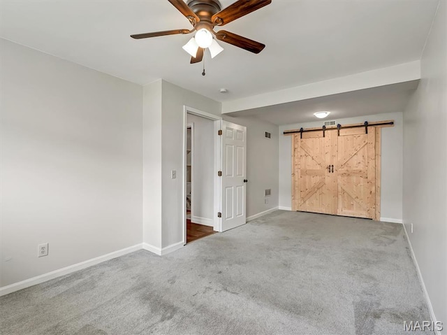 3178 5 Oaks Dr, Arnold, MO 63010 - carpeted empty room with a ceiling fan and a barn door