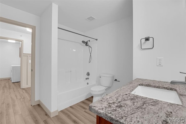 1531 Piedmont Cir Unit 1531, Saint Peters, MO 63304 - full bathroom with vanity, wood finished floors,  shower combination, and washer / clothes dryer