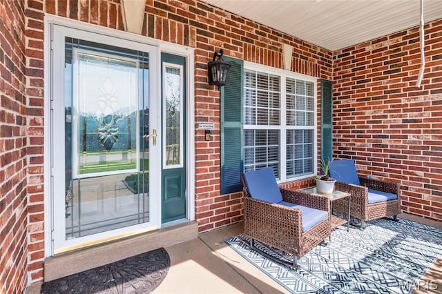 221 Meriwether Lewis Dr, Ofallon, MO 63368 - doorway to property with brick siding and a porch