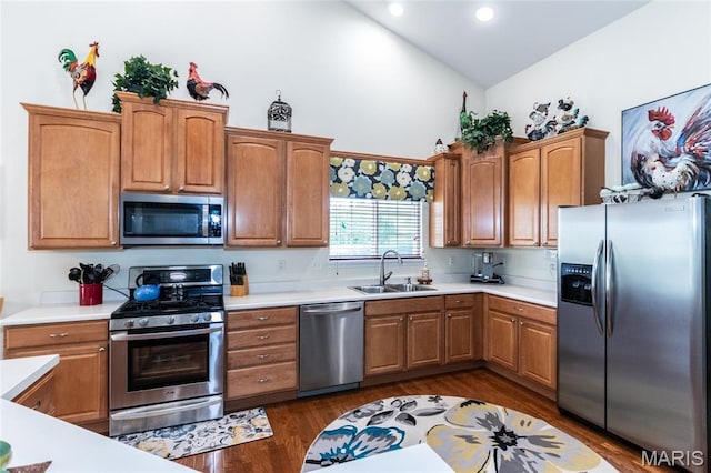 221 Meriwether Lewis Dr, Ofallon, MO 63368 - kitchen featuring stainless steel appliances, high vaulted ceiling, light countertops, dark wood-type flooring, and recessed lighting