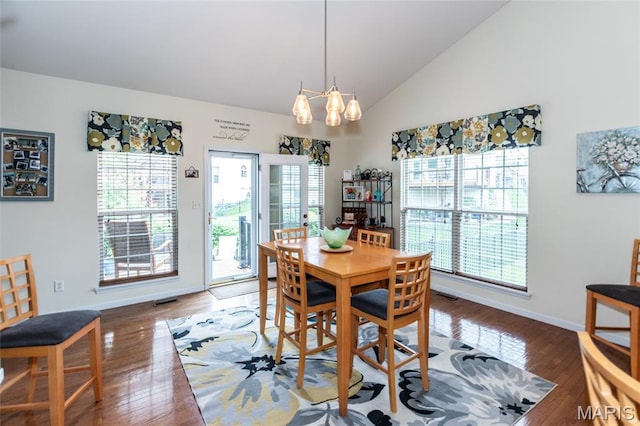221 Meriwether Lewis Dr, Ofallon, MO 63368 - dining room with wood finished floors, lofted ceiling, and a chandelier