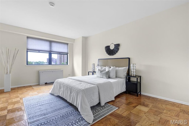 4466 W Pine Blvd Unit 7D, Saint Louis, MO 63108 - bedroom with radiator heating unit and baseboards
