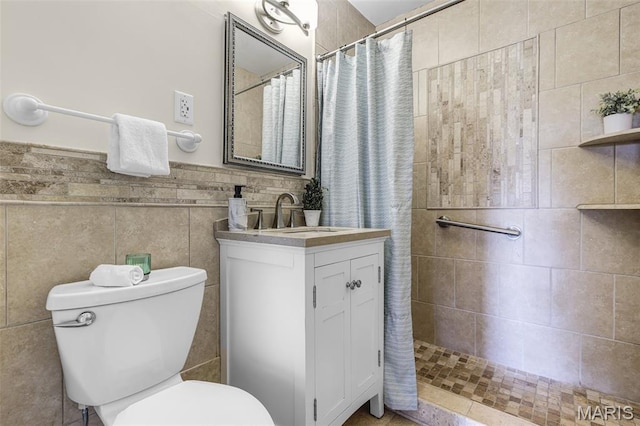 4466 W Pine Blvd Unit 7D, Saint Louis, MO 63108 - full bathroom with a tile shower, vanity, and tile walls