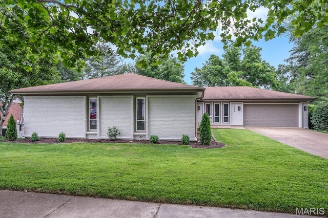 1254 Jade Wind Cir, Ballwin, MO 63011 - view of front of property featuring an attached garage, brick siding, driveway, and a front yard