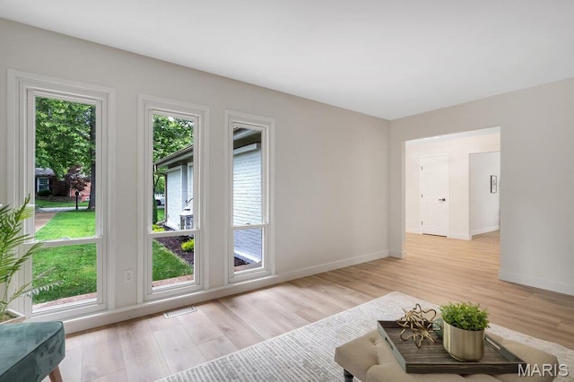 1254 Jade Wind Cir, Ballwin, MO 63011 - living room with light wood-style flooring and baseboards