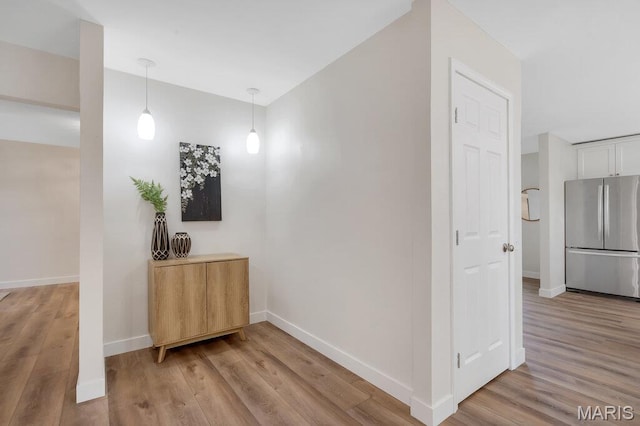 1254 Jade Wind Cir, Ballwin, MO 63011 - corridor with light wood-style floors and baseboards