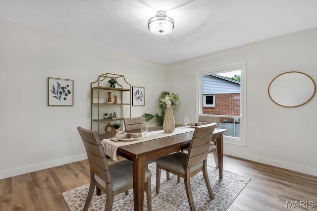 1254 Jade Wind Cir, Ballwin, MO 63011 - dining area with light wood-style flooring