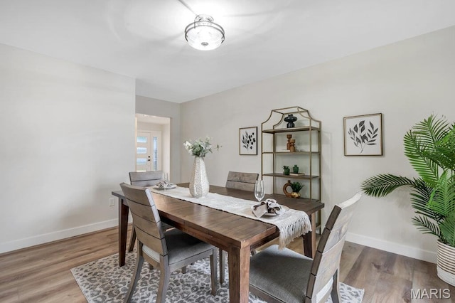 1254 Jade Wind Cir, Ballwin, MO 63011 - dining room with light wood-style flooring and baseboards