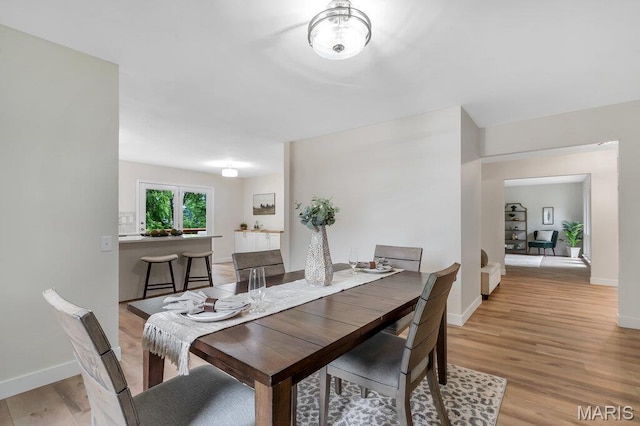 1254 Jade Wind Cir, Ballwin, MO 63011 - dining space with light wood finished floors and baseboards