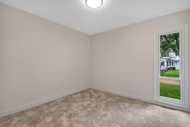 1254 Jade Wind Cir, Ballwin, MO 63011 - carpeted spare room featuring baseboards