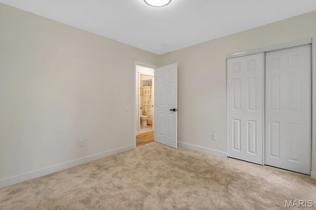 1254 Jade Wind Cir, Ballwin, MO 63011 - unfurnished bedroom featuring carpet flooring and a closet