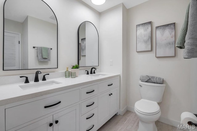1254 Jade Wind Cir, Ballwin, MO 63011 - bathroom featuring double vanity and wood finished floors