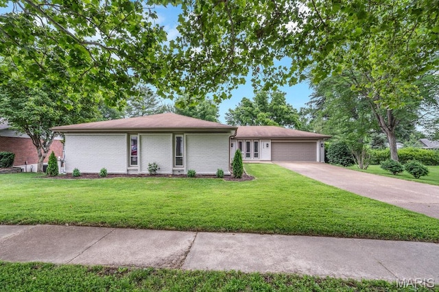 1254 Jade Wind Cir, Ballwin, MO 63011 - single story home featuring an attached garage, a front lawn, concrete driveway, and brick siding
