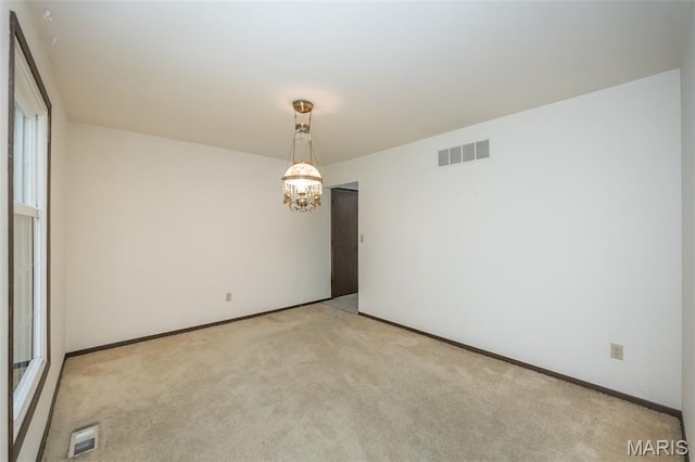 14898 Pheasant Hill Ct, Chesterfield, MO 63017 - empty room with light colored carpet and a chandelier