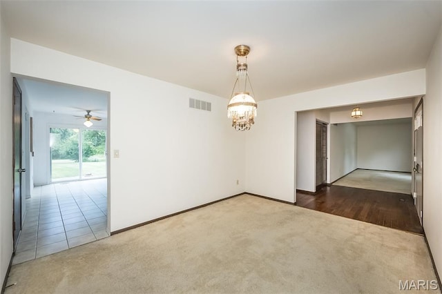 14898 Pheasant Hill Ct, Chesterfield, MO 63017 - carpeted spare room featuring a chandelier and ceiling fan