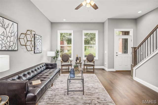 3400 Vista Ave, Saint Louis, MO 63104 - living room featuring dark wood finished floors, ceiling fan, stairs, and recessed lighting