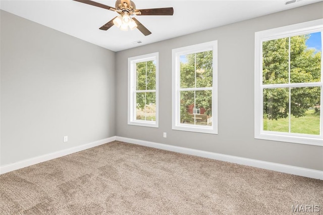 3400 Vista Ave, Saint Louis, MO 63104 - spare room featuring carpet, healthy amount of natural light, and a ceiling fan