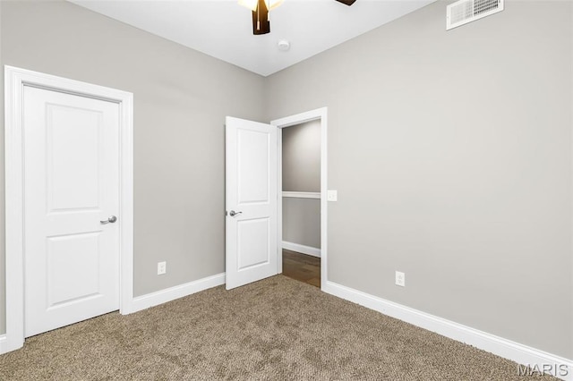 3400 Vista Ave, Saint Louis, MO 63104 - unfurnished bedroom featuring carpet floors and a ceiling fan