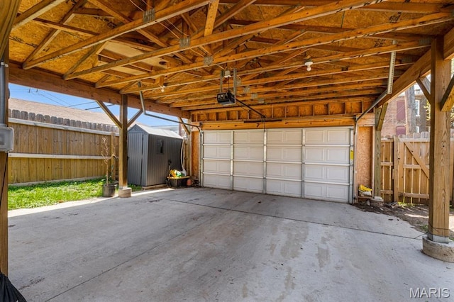 3400 Vista Ave, Saint Louis, MO 63104 - garage featuring a storage shed and a garage door opener