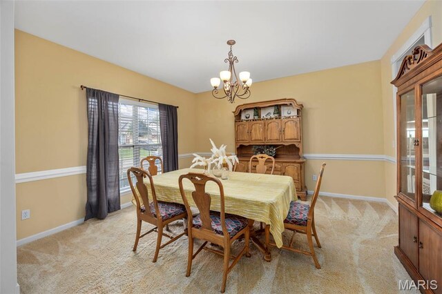 24 Milton Brennan Manor Ct, Wentzville, MO 63385 - dining room featuring a chandelier and light carpet