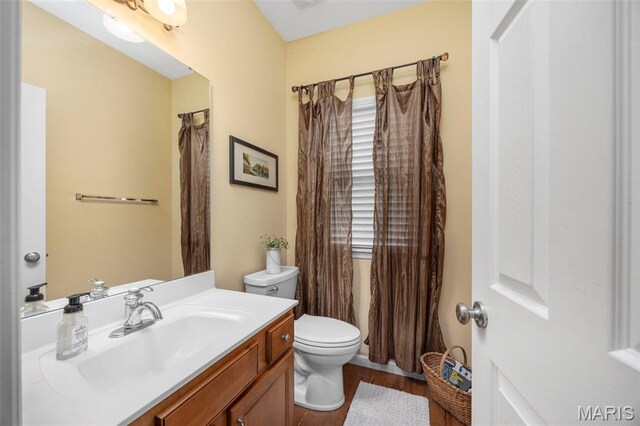 24 Milton Brennan Manor Ct, Wentzville, MO 63385 - full bathroom with vanity and wood finished floors