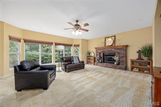 24 Milton Brennan Manor Ct, Wentzville, MO 63385 - carpeted living room featuring ceiling fan and a brick fireplace